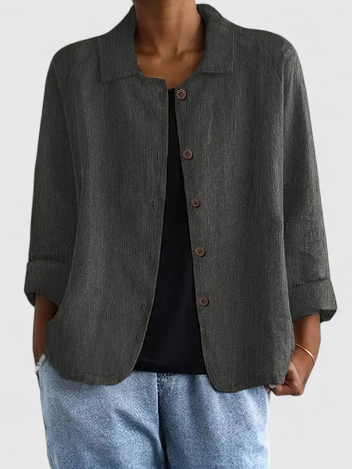 Relaxed loose-fit women's top, a versatile layering piece. Button-front detail for casual & stylish wear.
