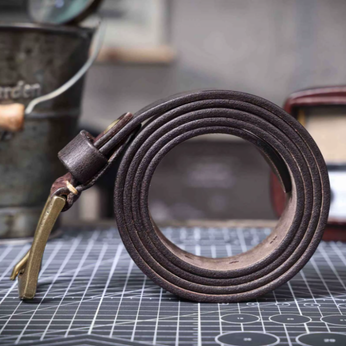 Rich brown full grain leather belt for men, highlighting premium quality and construction.
