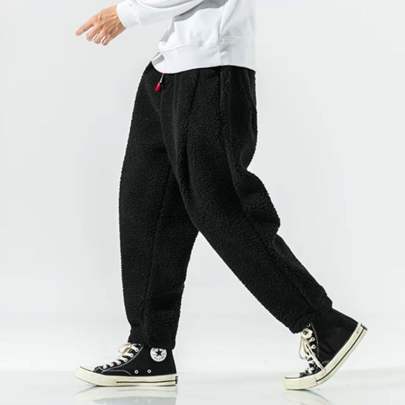 Fashionable unisex relaxed fit winter pants, offering warmth & comfort for cold days.