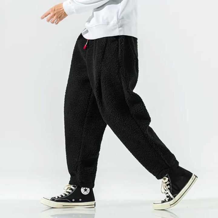 Fashionable unisex relaxed fit winter pants, offering warmth & comfort for cold days.