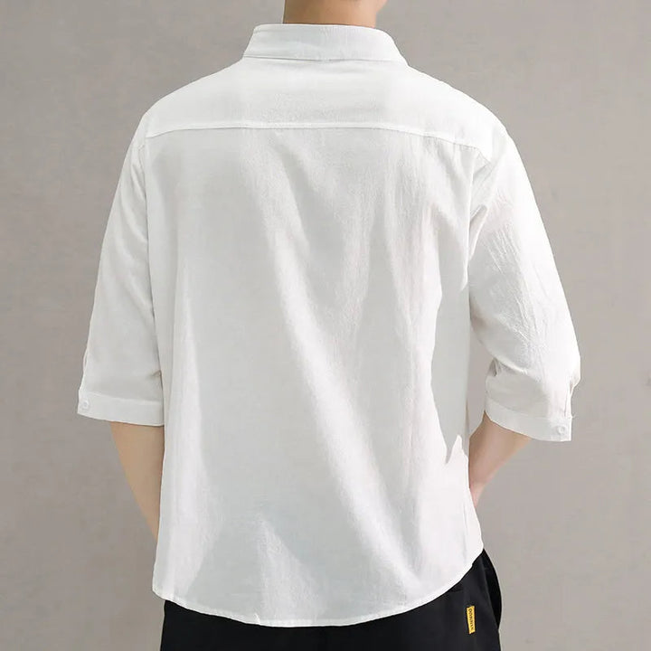 Men's casual long-sleeve button-up cotton shirt, offering breathable comfort and everyday style.