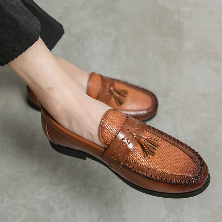 Stylish men's woven tassel loafers combining comfort and classic design. Easy slip-on shoes for refined formal or casual wear.