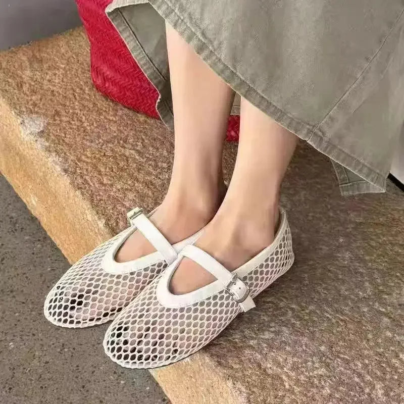 Women's breathable mesh Mary Jane flats featuring a secure buckle strap and comfy design.