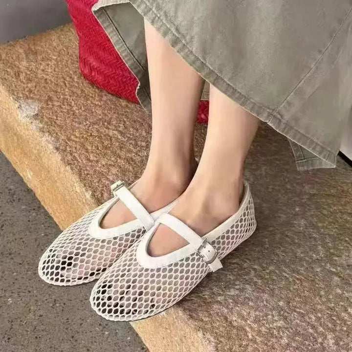 Women's breathable mesh Mary Jane flats featuring a secure buckle strap and comfy design.