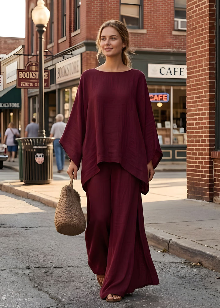 Effortless resort wear: matching women's two-piece set with a cape top & flowy wide leg pants.