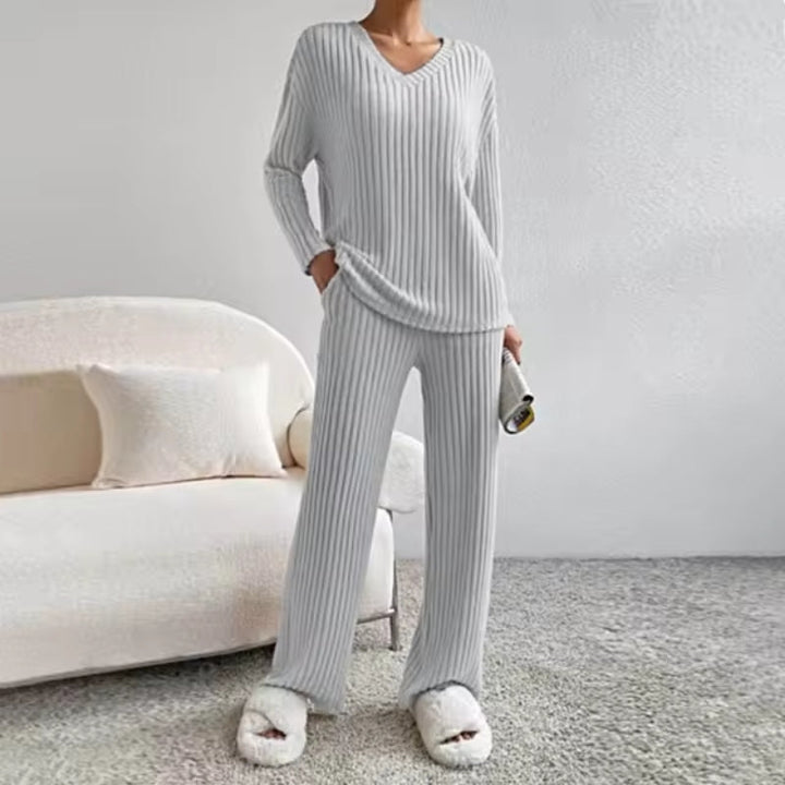 Versatile women's cozy ribbed knit loungewear set. Stylish two-piece outfit with V-neck sweater & comfortable pants.