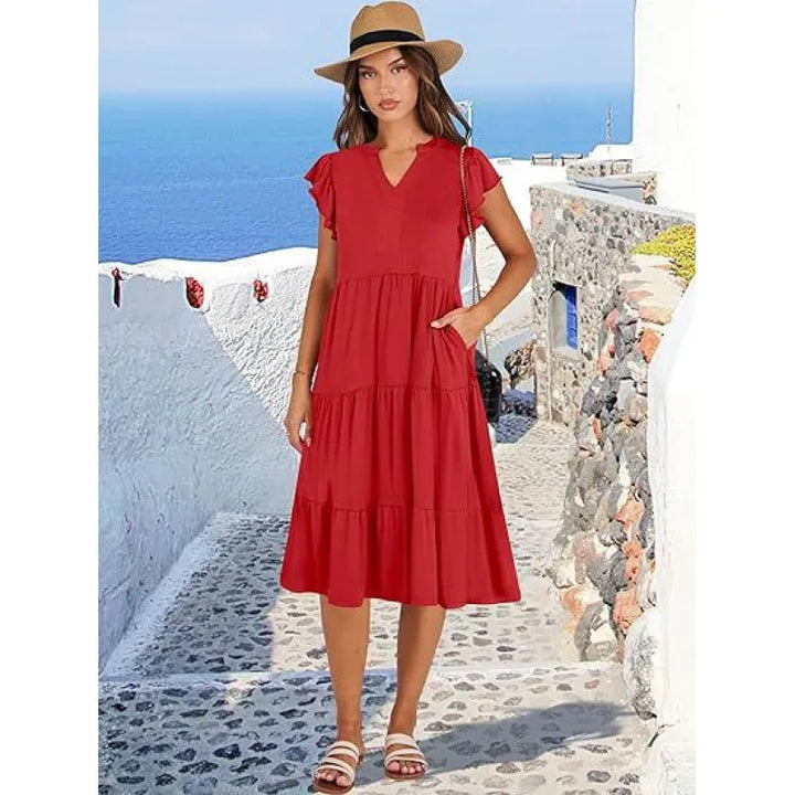 Front view of a women's V-neck tiered midi dress with delicate flutter sleeves, perfect for sunny days.