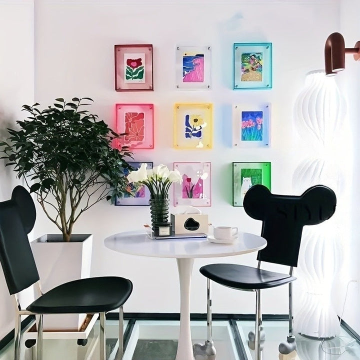 Freestanding acrylic picture frame, modern table display for photos, home & office decor.