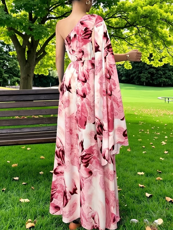 Stylish women's one-shoulder wedding guest dress. Long, elegant evening gown for formal occasions.