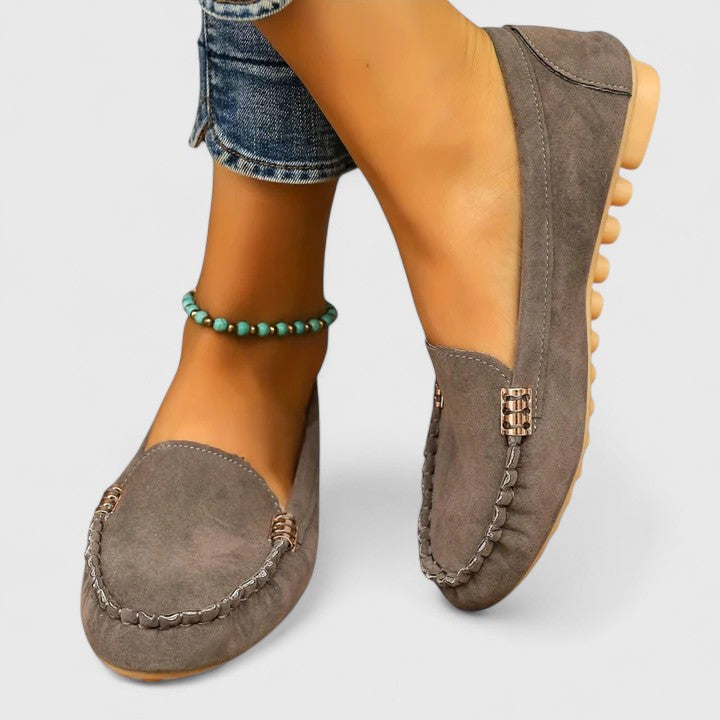High-quality women's orthopedic slip-on loafers with metal accents for superior comfort and style.