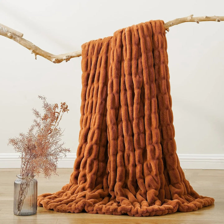 Versatile faux fur throw blanket, soft, plush, and decorative for any home space.