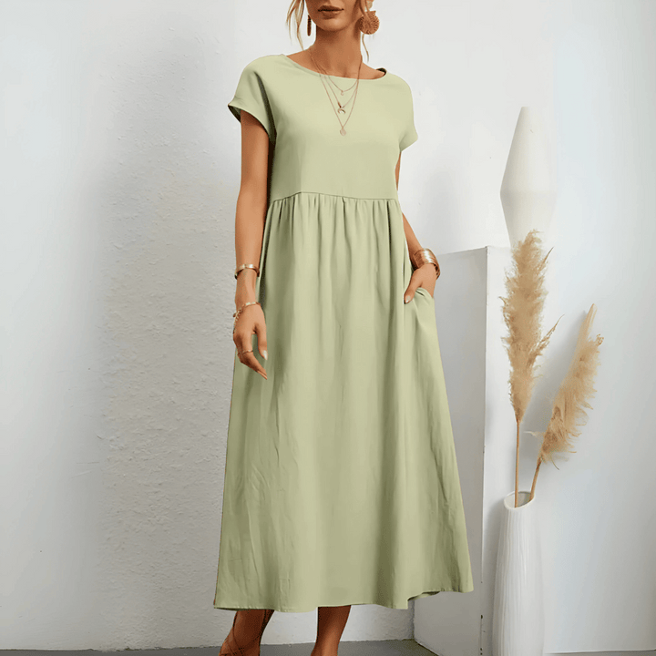 Beautiful vintage style maxi dress for women, with a pleated flowy skirt, O-neck, and comfortable short sleeves for summer.