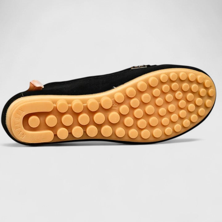 Comfort-focused women's orthopedic slip-on loafers, featuring stylish metal accents for any occasion.