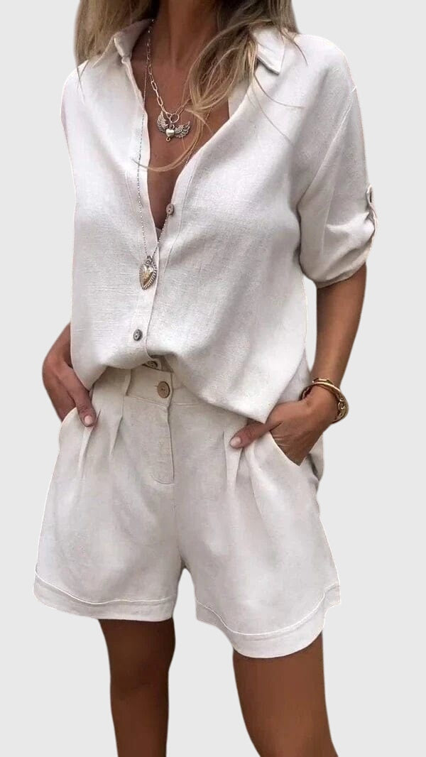 Comfortable women's two piece lounge wear set with short sleeve top & matching shorts for relaxation.