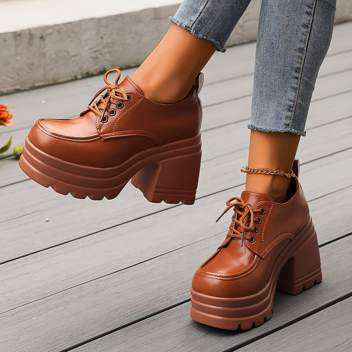 Brown women's platform oxfords, chunky block heel, comfortable lace-up design for versatile retro footwear.
