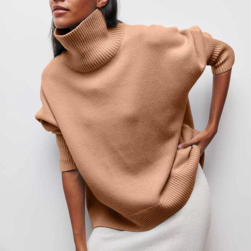 Ultra-cozy oversized knit turtleneck sweater for women. Essential warm top for winter fashion.