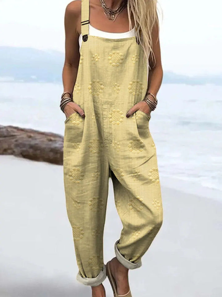 Women's versatile patterned wide-leg jumpsuit, relaxed fit with pockets, offering stylish comfort for spring/summer.