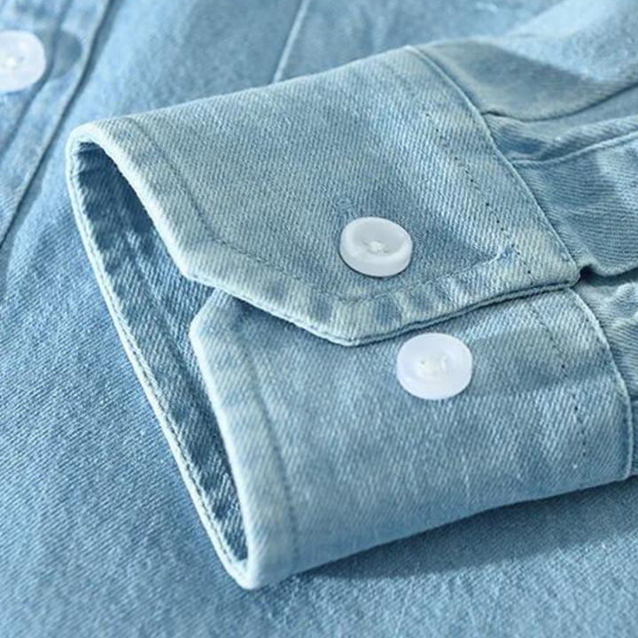 Fashionable men's black long sleeve denim shirt, a versatile button-down in a modern fit for casual style.