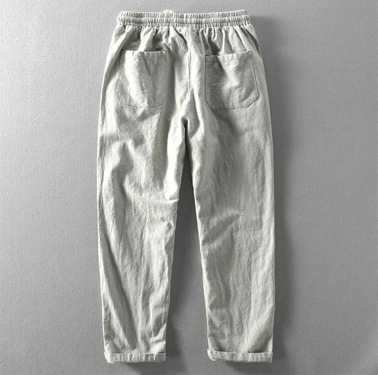 Solid color men's relaxed fit Zen trousers, a modern menswear essential for versatile comfort.