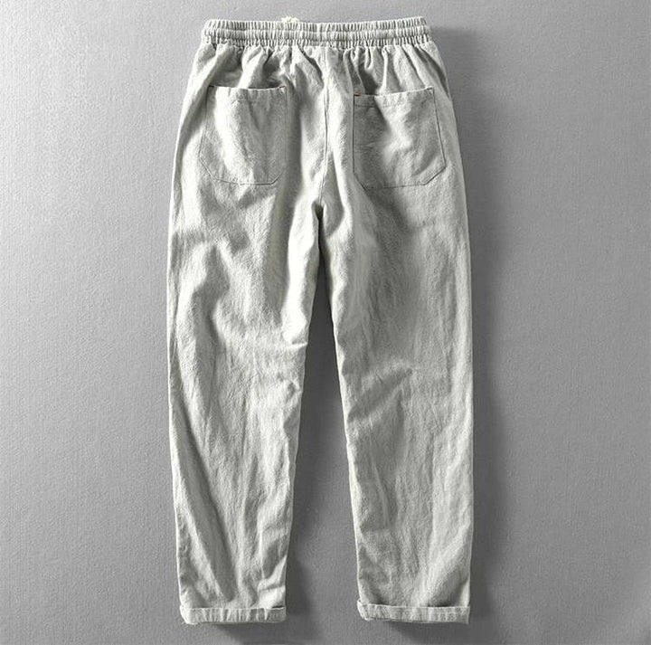 Solid color men's relaxed fit Zen trousers, a modern menswear essential for versatile comfort.