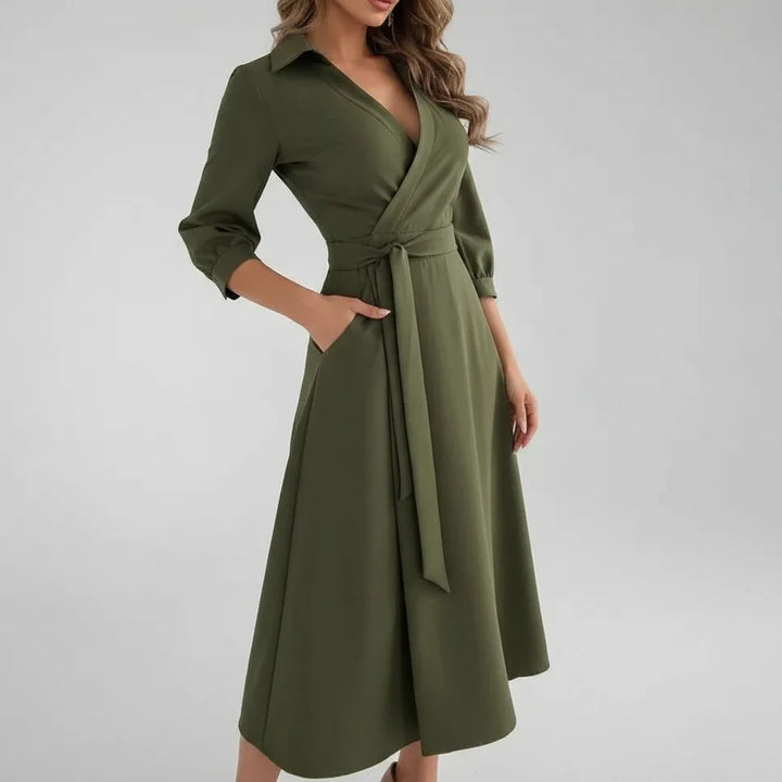 Elegant women's belted A-line midi dress. Features a V-neck, 3/4 sleeves, ideal for comfortable daily wear.