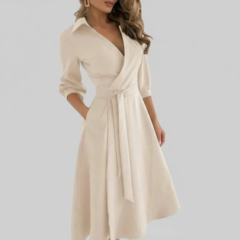 Summer-ready women's A-line midi dress. Belted waist, V-neck, 3/4 sleeves. Chic and comfortable elegant fashion.
