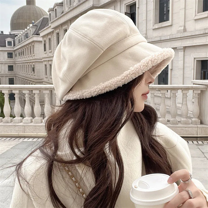 Chic women's velvet beret, a fashionable and warm winter hat. Perfect stylish headwear and classic accessory.