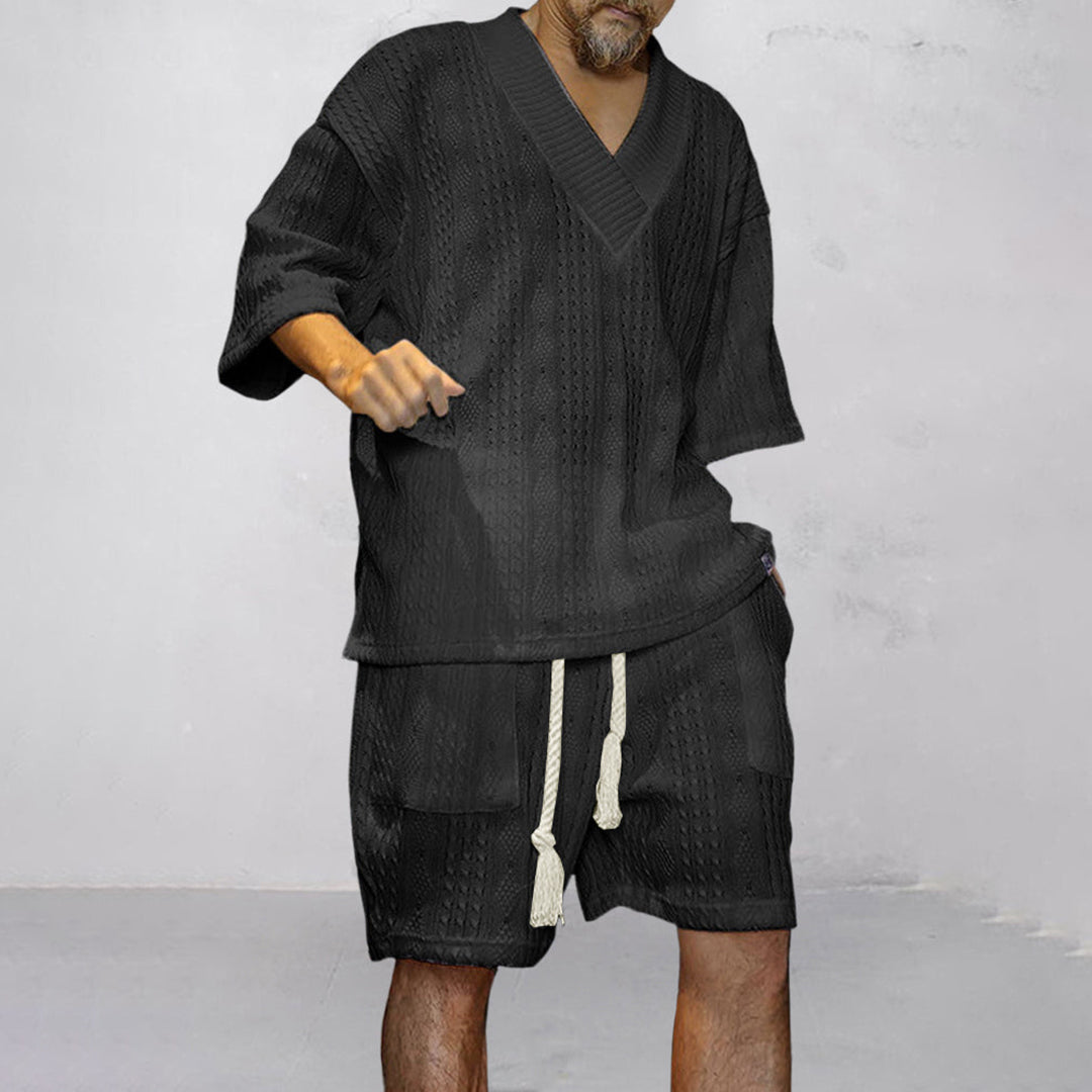 Casual men's V-neck shirt & shorts set, perfect coordinated loungewear for relaxed summer days.