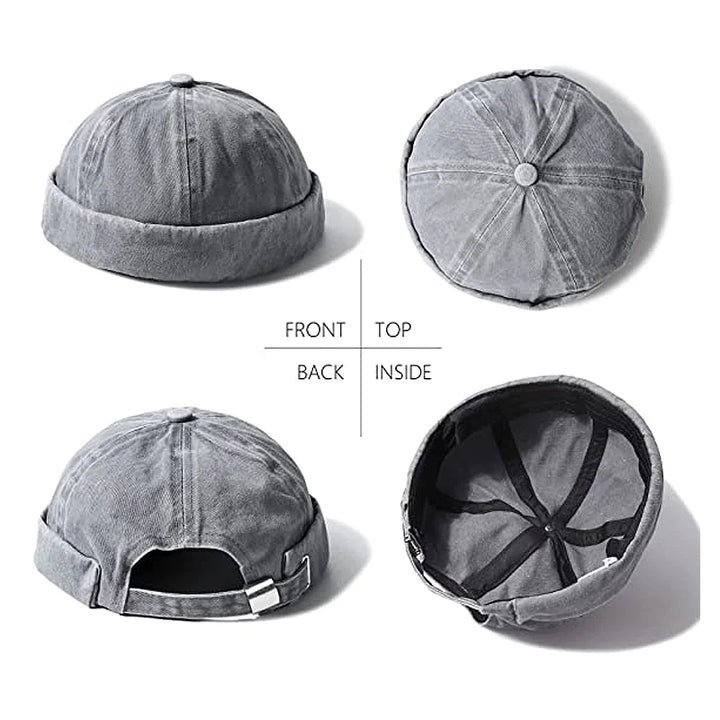 Fashionable unisex brimless cap in black, washed cotton, rolled cuff detail. Versatile accessory.