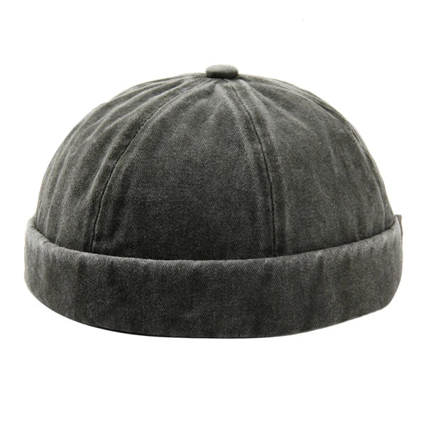 Unisex washed brimless cotton cap in black, adjustable for a comfortable fit. Stylish headwear.