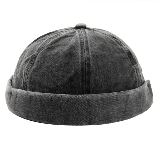 Gray washed brimless cap with rolled cuff, soft cotton, adjustable. Modern unisex style.