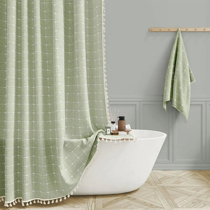 Soft bohemian linen shower curtain, featuring tassels, ideal for a cozy bathroom upgrade.