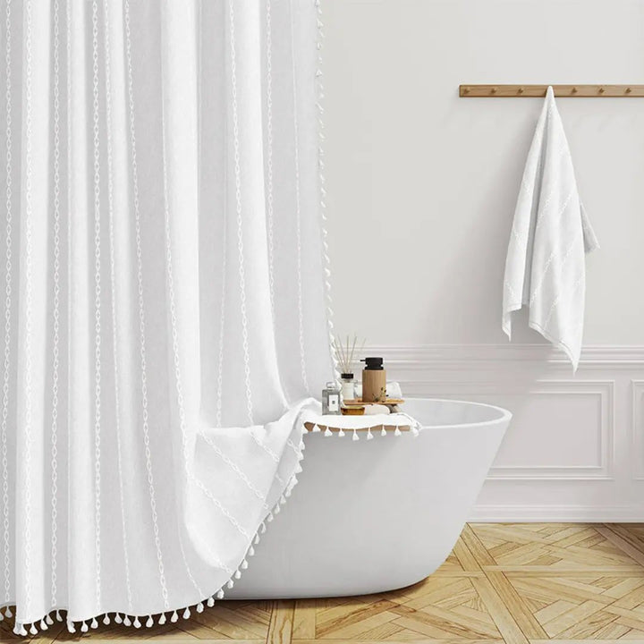 Elegant bohemian linen shower curtain with tassels, waterproof, enhances bathroom style.