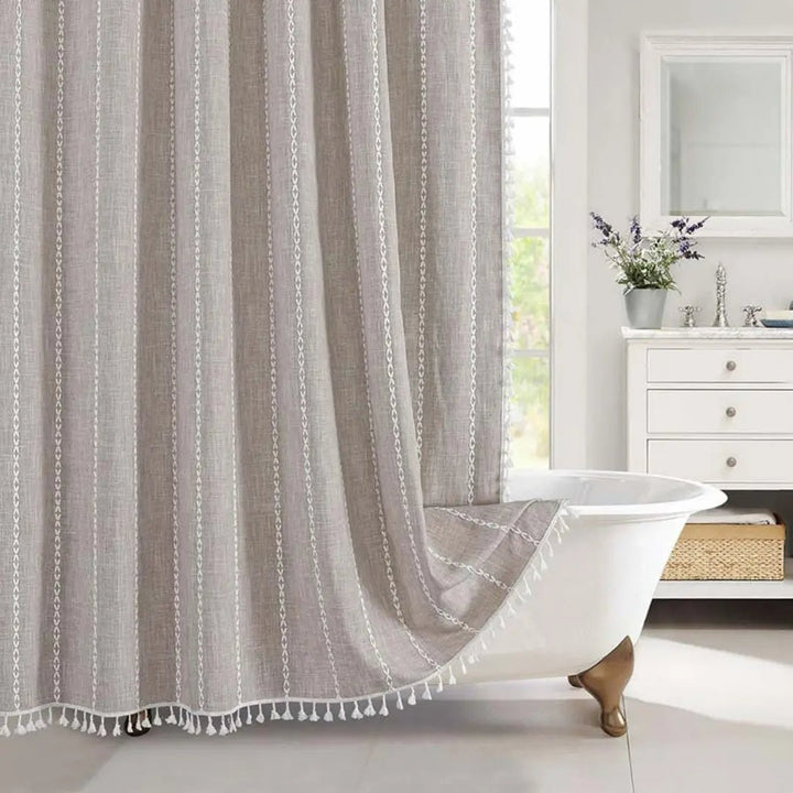 Boho chic linen shower curtain with tassels, perfect for a waterproof and stylish bathroom setting.