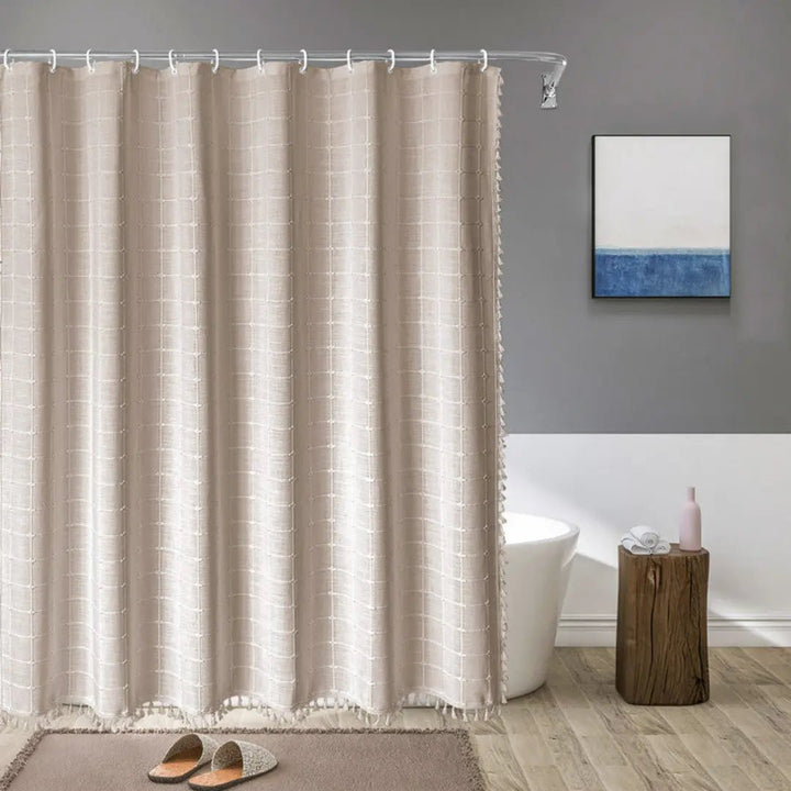 Bohemian linen shower curtain with tassels for a stylish modern farmhouse bathroom.
