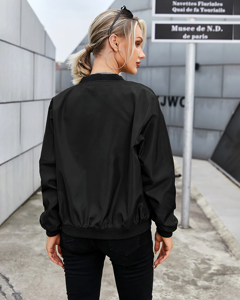Stylish women's zip-up bomber jacket in burgundy, offering effortless comfort for fall and spring outfits.