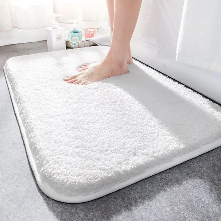 Soft, luxurious bath mat with cloud-like comfort. Absorbent microfiber & non-slip design for safe, cozy bathroom decor.