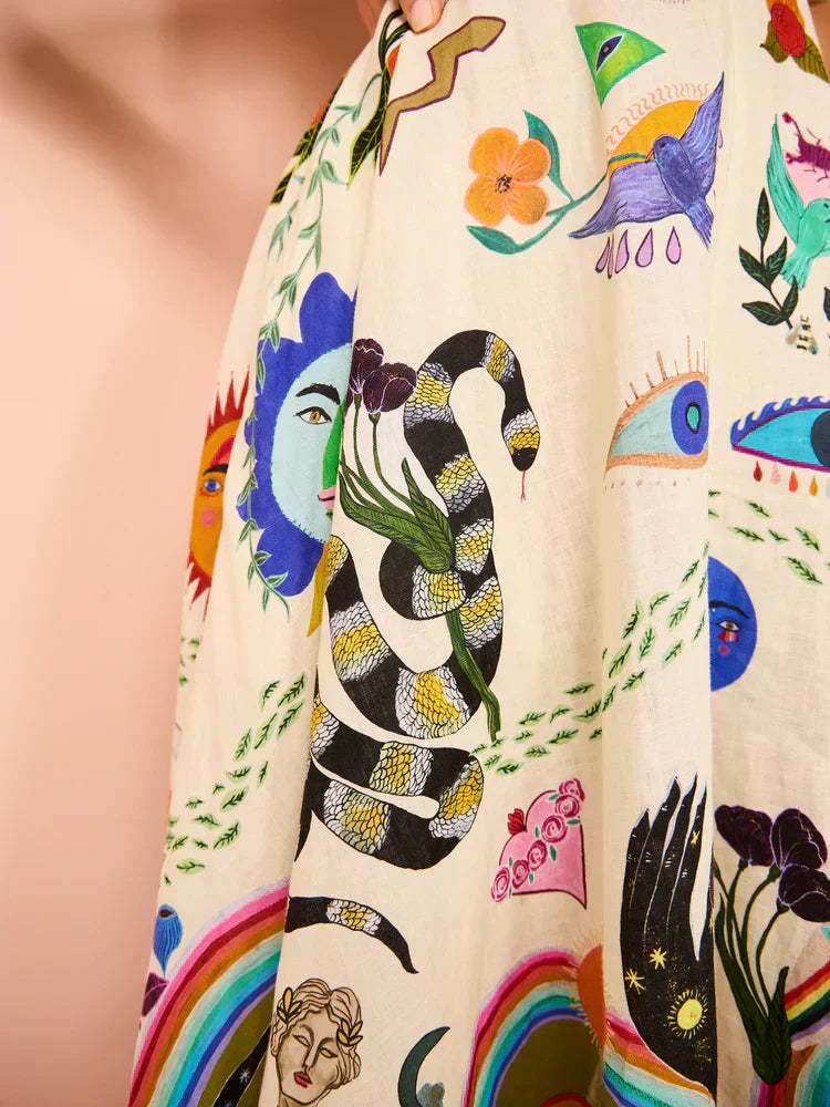 Vibrant multicolor pattern on a women's boho maxi sundress, highlighting the flowy design & spaghetti straps.