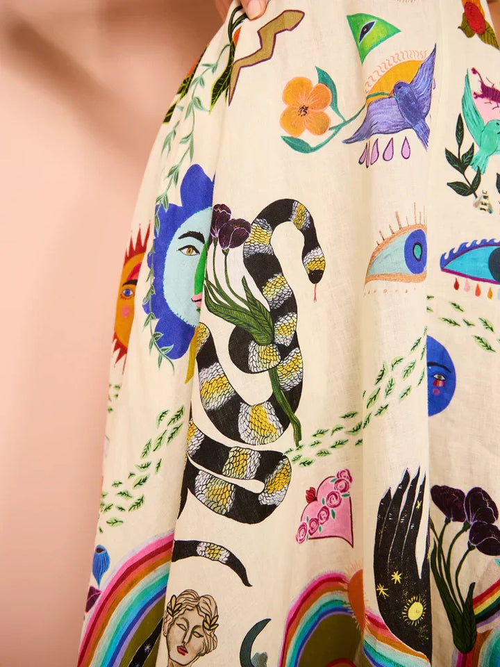 Vibrant multicolor pattern on a women's boho maxi sundress, highlighting the flowy design & spaghetti straps.
