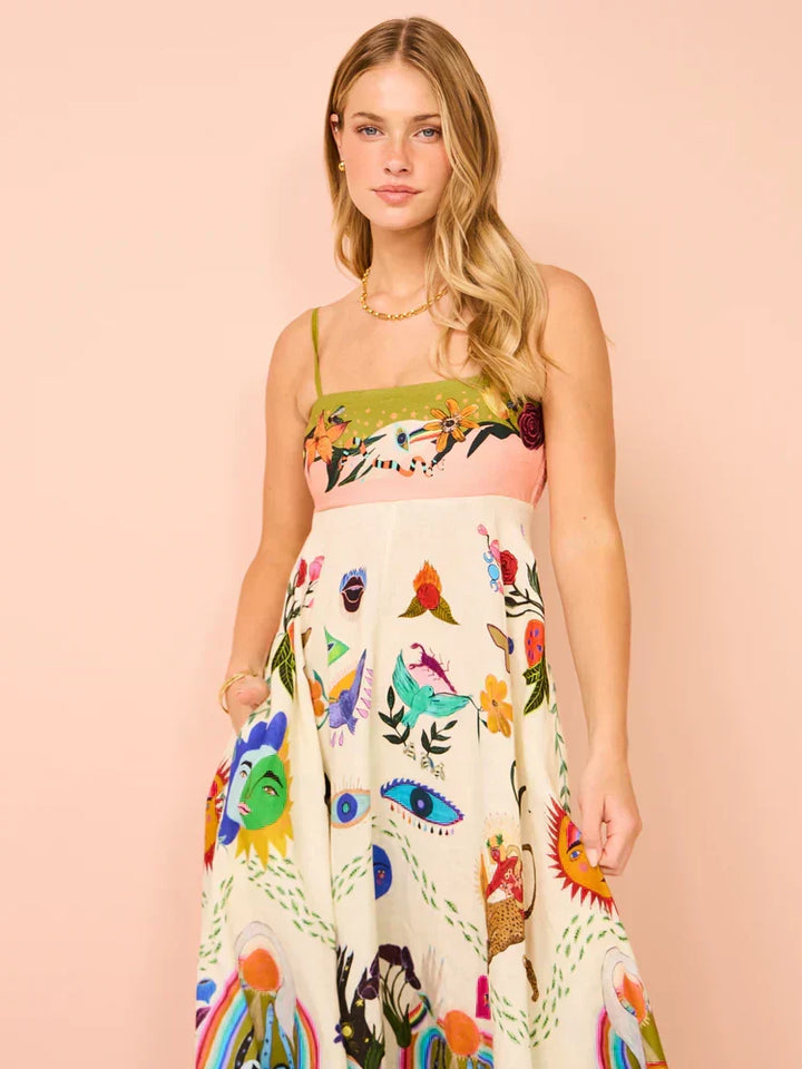 Woman in a flowing multicolor boho maxi dress, showcasing its elegant movement & casual style for summer.