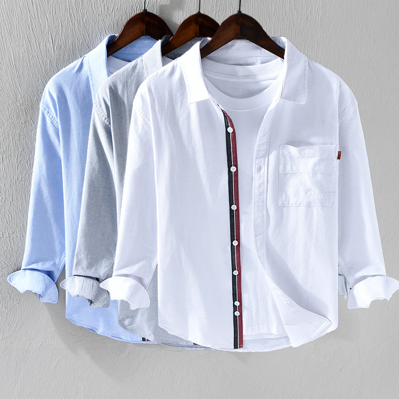 Comfortable pink men's oxford shirt. Versatile long sleeve button-down for stylish casual outings or office.