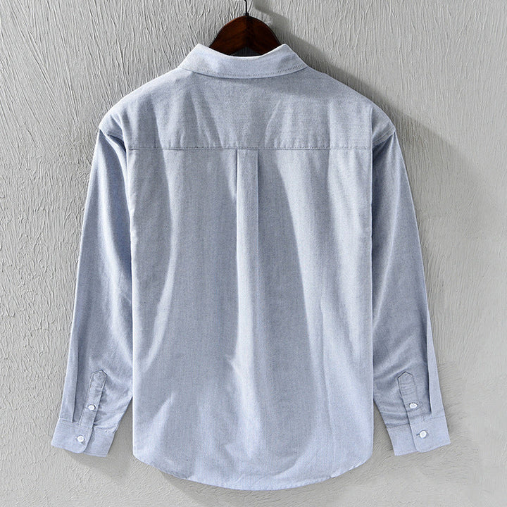 Crisp white men's oxford shirt. Comfortable & stylish long sleeve button-down for versatile office & casual looks.