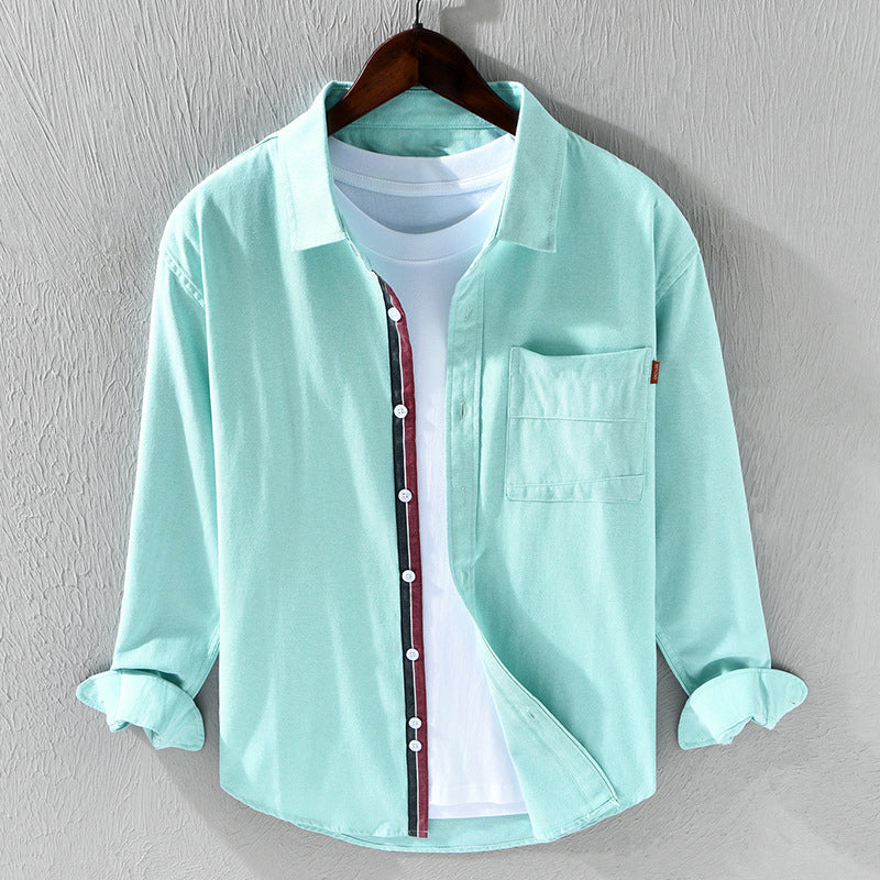 Green men's stylish oxford shirt. Versatile long sleeve button-down for comfortable casual & office wear.