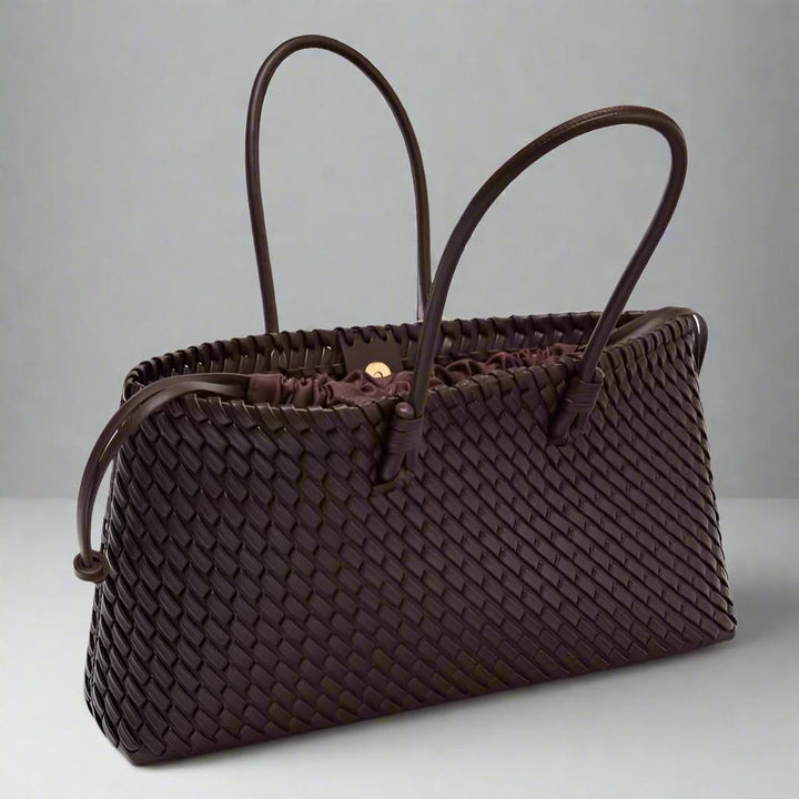 Stylish women's woven leather purse, a chic fashion accessory for daily elegance.