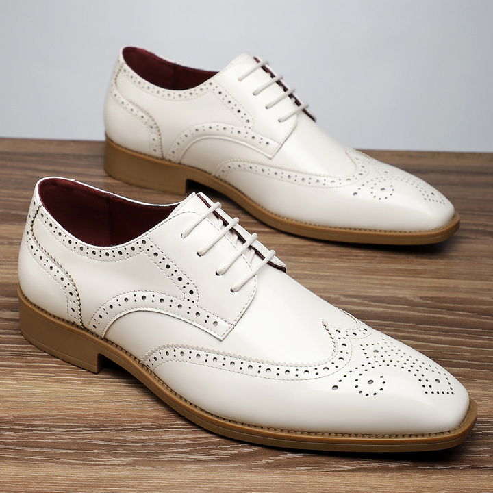 Men's premium leather wingtip brogues, designed for comfort and elegance in business and formal settings.
