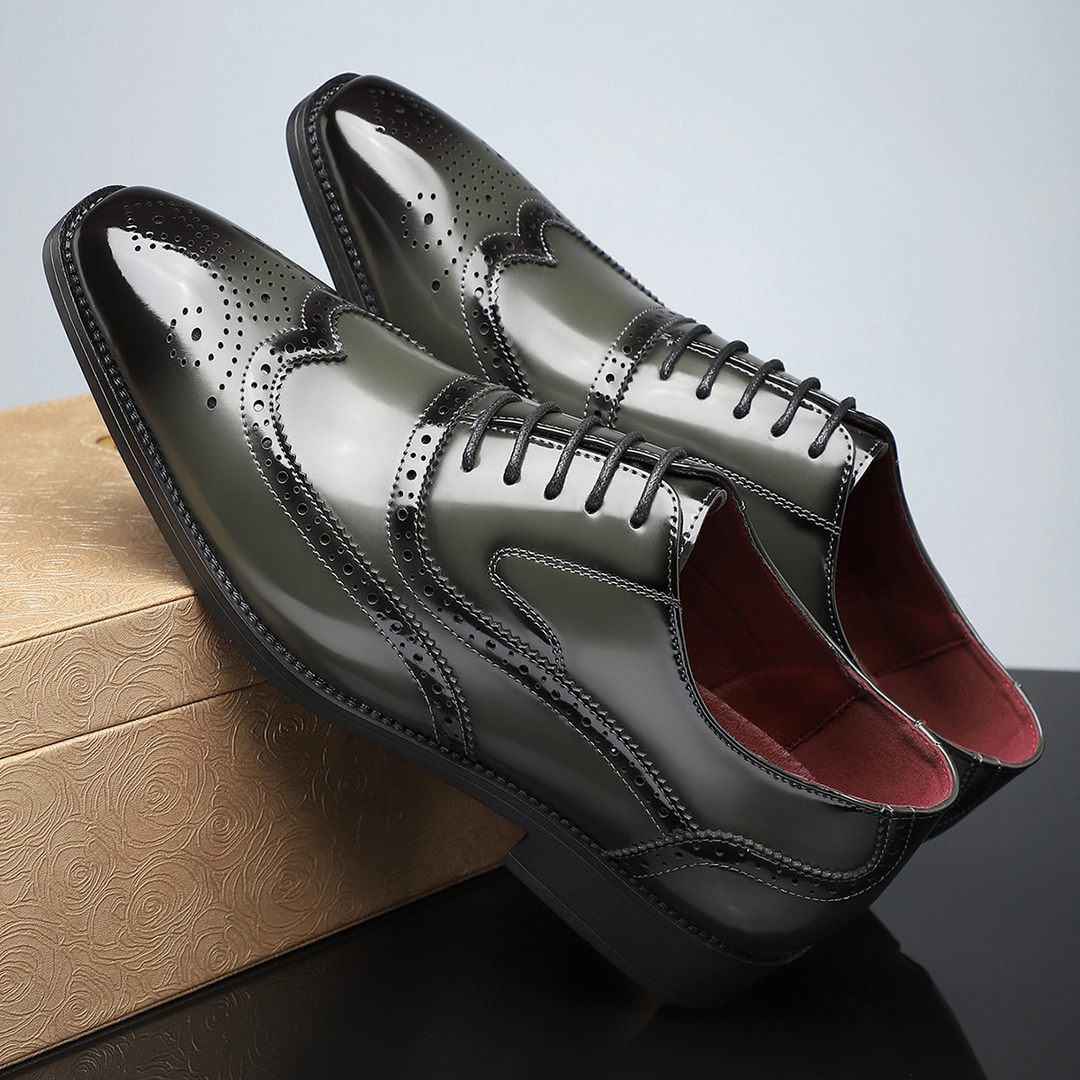 Polished men's formal wingtip dress shoes with classic brogue pattern, perfect for elegant events.