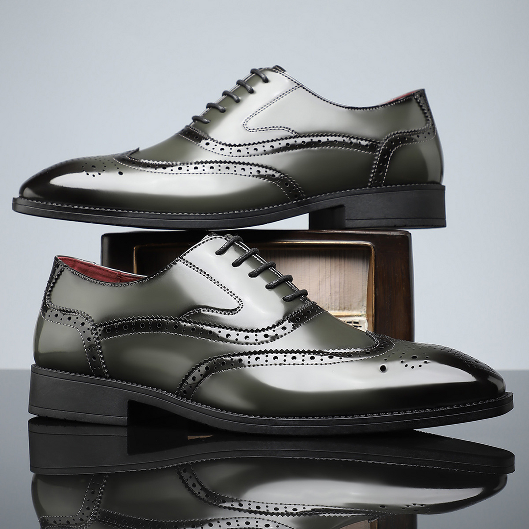 Close-up of the intricate brogue detailing on men's leather wingtip dress shoes for a refined look.