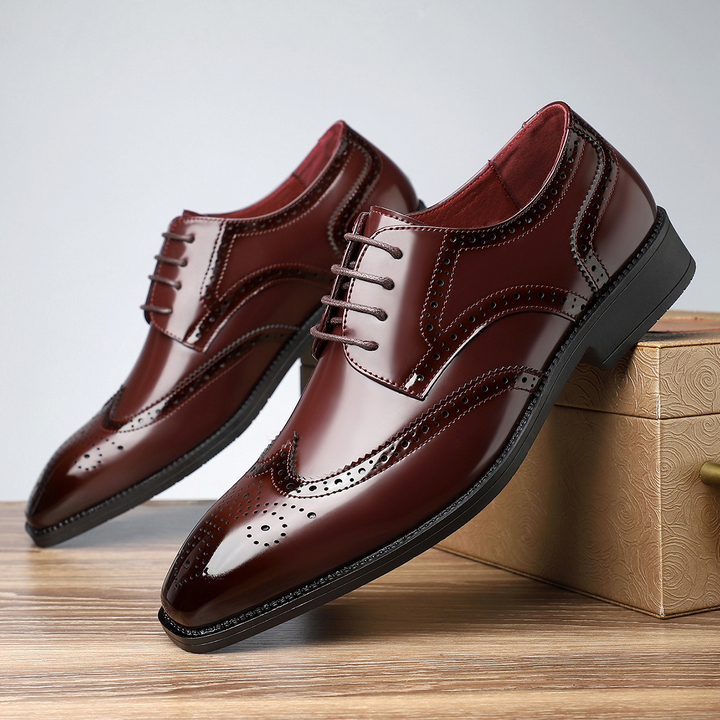 Stylish men's leather wingtip brogues, combining classic design with comfort for business attire.