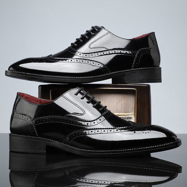 Men's sleek black wingtip brogue dress shoes, a timeless choice for formal events and business.