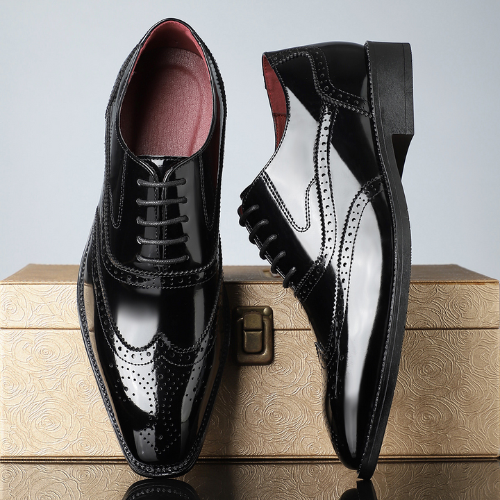 Side profile of elegant men's wingtip brogues, showcasing sophisticated design for business attire.